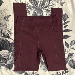 VS burgundy 3 pocket leggings.